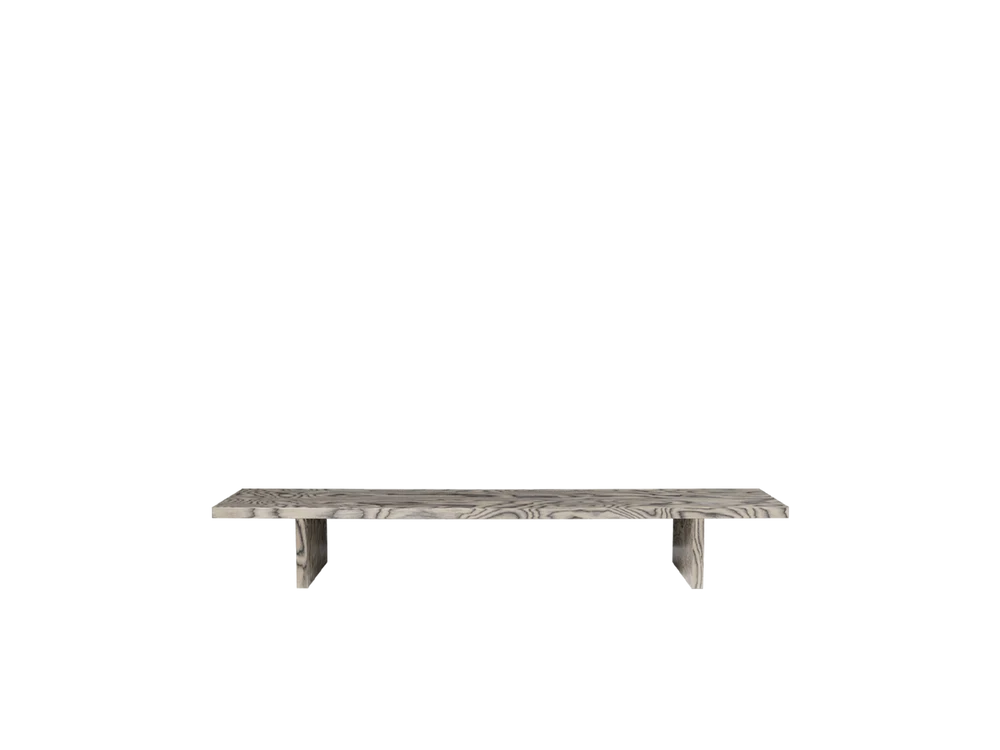Ferm Living Kona Display Table used as a stylish seating piece, featuring a modern design and natural wood finish.
