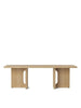 Androgyne Lounge Table by Audo Copenhagen in natural oak with sleek, modern design, showcasing its smooth surface and stylish form.