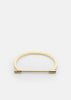 Gold plated Omega bangle by Skultuna, featuring a sleek and minimalist design in shiny gold finish.
