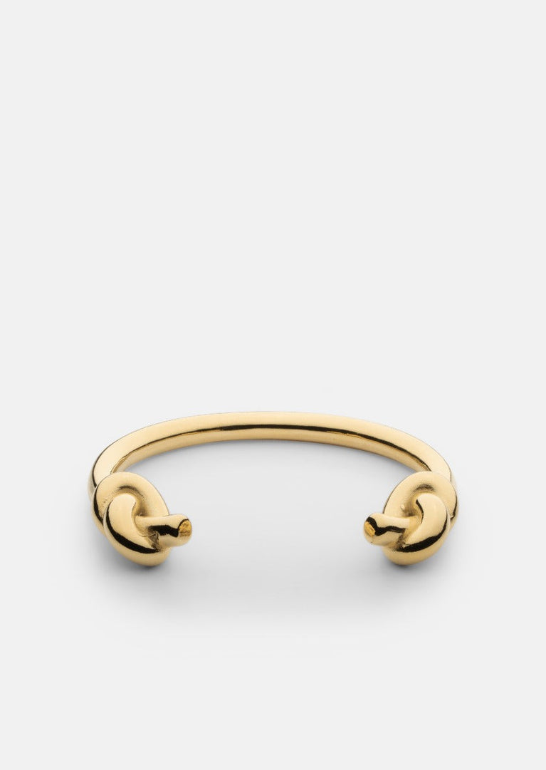 Gold-plated Massive Knot Cuff bracelet by Skultuna showcasing a bold, elegant accessory with a polished finish and intricate knot design.