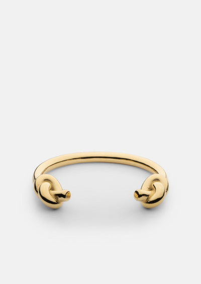 Gold-plated Massive Knot Cuff bracelet by Skultuna showcasing a bold, elegant accessory with a polished finish and intricate knot design.