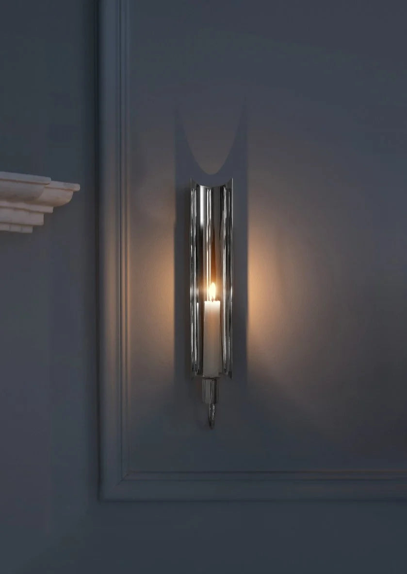 Reflex Sconce in silver plating by Skultuna, modern wall-mounted accessory with sleek metallic finish.