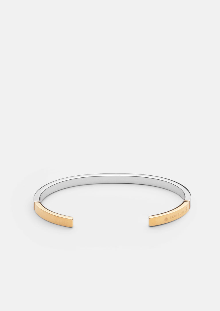 Skultuna SB Cuff Thin two-tone steel and gold accessory with sleek, minimalist design for stylish wear.