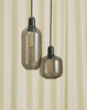 Large Amp Lamp by Normann Copenhagen in smoke black with a sleek, modern lighting design.