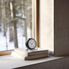 Arne Jacobsen Station Table Clock, minimalist accessories with sleek design, featuring a round face and modern style.