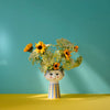 Eva Vase by Bjørn Wiinblad, a decorative ceramic accessory with intricate floral patterns and vibrant colors.
