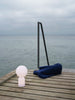 Small white Yo table lamp by Normann Copenhagen, modern lighting fixture with a sleek, minimalist design.