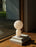 Small white Yo Table Lamp by Normann Copenhagen, modern lighting fixture with a sleek, minimalist design for indoor use.