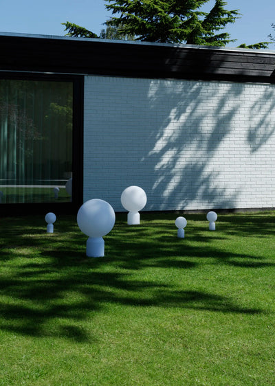 Small Yo Table Lamp by Normann Copenhagen, modern lighting with a sleek design, shown in a well-lit setting.