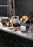 Skultuna Nurture Watering Can accessory with a sleek, modern design, featuring a metallic finish and elegant handle.