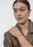 Gold plated Relier Nano bracelet by Skultuna, shown on a white background with a sleek, minimalist design.