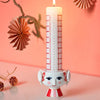 Red Eva Christmas candle holder by Bjørn Wiinblad, decorative accessory with intricate design, measures 3.1 inches tall.