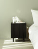 Rib Bedside Table by Normann Copenhagen in soft black with ribbed design, modern table perfect for bedroom or living space.