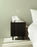 Rib Bedside Table by Normann Copenhagen in soft black with ribbed design, modern table perfect for bedroom or living space.