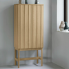 High oak Rib Cabinet storage unit by Normann Copenhagen featuring ribbed doors and a sleek modern design.