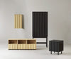 Rib Cabinet High by Normann Copenhagen, modern storage unit with ribbed surface, wooden legs, and sleek design.