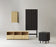 Rib Cabinet High by Normann Copenhagen, modern storage unit with ribbed surface, wooden legs, and sleek design.