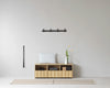 Rib Sideboard Low Hybrid by Normann Copenhagen featuring oak finish, black storage compartments, and a minimalist design.