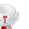 Red Eva Christmas candle holder by Bjørn Wiinblad, decorative accessory with intricate design, stands 3.1 inches tall.