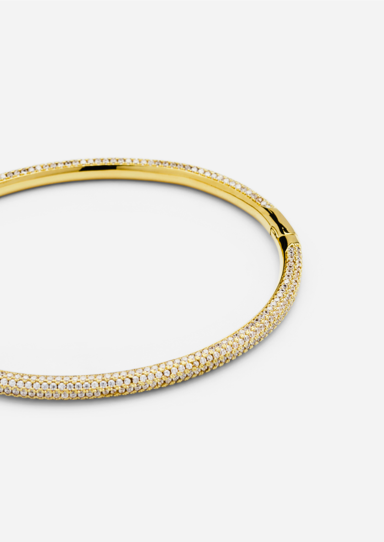 Gold plated Simplicity Pavé Bangle by Skultuna, showcasing a sleek, elegant jewelry accessory with sparkling pavé detailing.