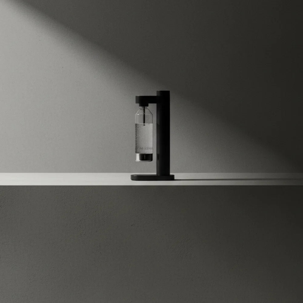 Brus Carbonator Stelton accessory with sleek black design, featuring a compact, modern appearance and textured surface.