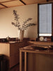 Ferm Living Curvature Dish Rack holding clean dishes on a kitchen countertop, modern design with curved metal bars.
