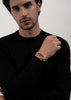 Gold plated ribbed cuff bracelet by Skultuna, showcasing a textured design on a sleek accessory.