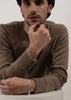 Silver plated Paul Chain bracelet by Skultuna, featuring a sleek chain design, worn as stylish accessories on a wrist.