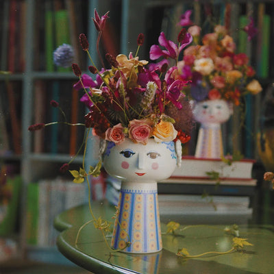 Eva Vase by Bjørn Wiinblad, decorative ceramic accessories with colorful floral design, shown in a close-up view.
