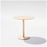Round pedestal cafe table by Bend Goods with tan finish, featuring a sleek metal design ideal for modern dining or cafe settings.