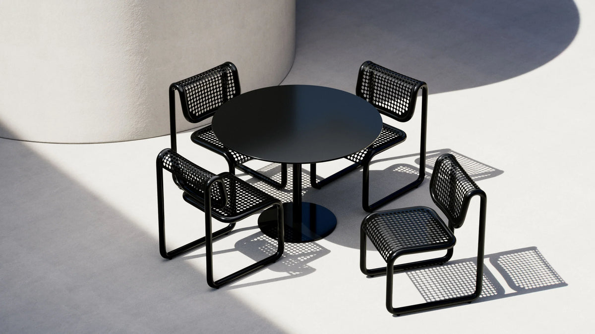 Round Bend Goods pedestal cafe table with a sleek surface and sturdy base, designed for stylish dining and cafe settings.