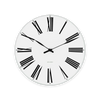 Roman wall clock by Arne Jacobsen with minimalist design and Roman numerals, perfect as stylish home accessories.