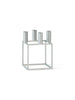 Audo Copenhagen Kubus zinc accessory with geometric shape and metallic finish, displayed from an angled view.