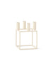 Audo Copenhagen Kubus accessory in ivory, featuring modern geometric design, displayed from an angled perspective.