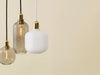 Large brass Amp Lamp by Normann Copenhagen, modern lighting fixture with a sleek, minimalist design.