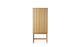 High ribbed oak cabinet by Normann Copenhagen for storage, featuring a modern design with vertical grooves and sleek handles.