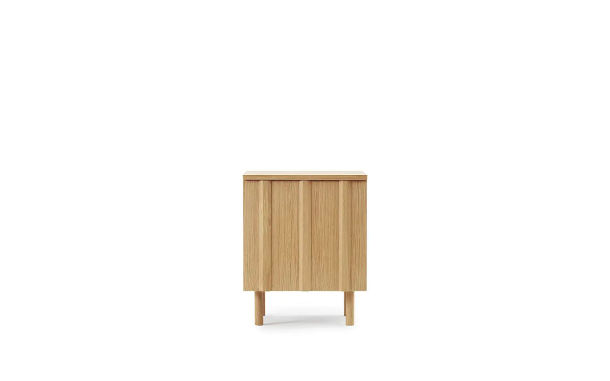Rib Bedside Table by Normann Copenhagen in oak with ribbed design, modern wooden table for bedroom or living space.