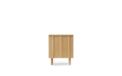 Rib Bedside Table by Normann Copenhagen in oak with ribbed design, modern wooden table for bedroom or living space.
