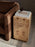 Burl side table by Ferm Living featuring a sleek wooden surface and modern design, perfect for living room or bedroom decor.