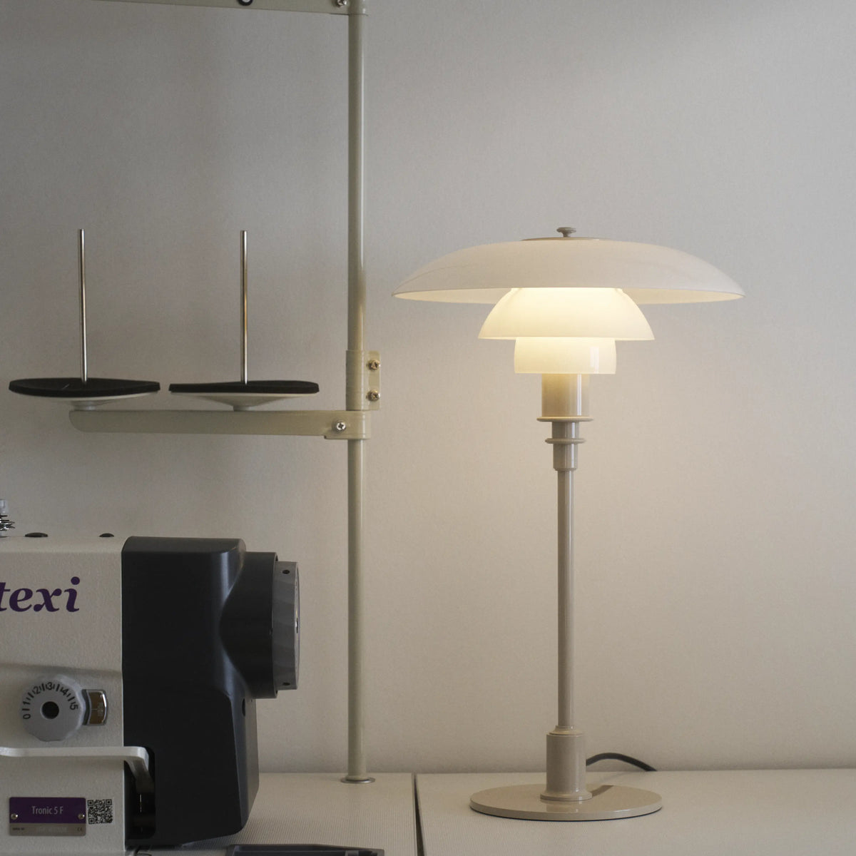 Louis Poulsen PH 3/2 glass table lamp with sleek design and transparent glass shade, perfect for modern lighting decor.
