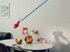 Modern 265 by Flos lighting fixture with sleek design and adjustable arm, mounted on a white wall.