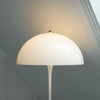 Louis Poulsen Panthella Floor Lamp with white curved shade and slim base, modern lighting fixture for stylish interior illumination