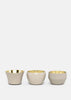 Set of three beige Kin by Skultuna candle holders, elegant accessories with a sleek, modern design.
