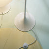 Louis Poulsen Panthella Floor lamp with white LED shade and slim metal base, modern lighting fixture for stylish interiors.
