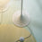 Louis Poulsen Panthella Floor lamp with white LED shade and slim metal base, modern lighting fixture for stylish interiors.