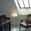 Louis Poulsen Panthella Floor lamp featuring a curved white shade and sleek stand, modern lighting for living spaces.