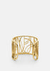 Skultuna Dew Cuff accessory featuring a sleek, modern design with metallic finish, displayed on a neutral background.