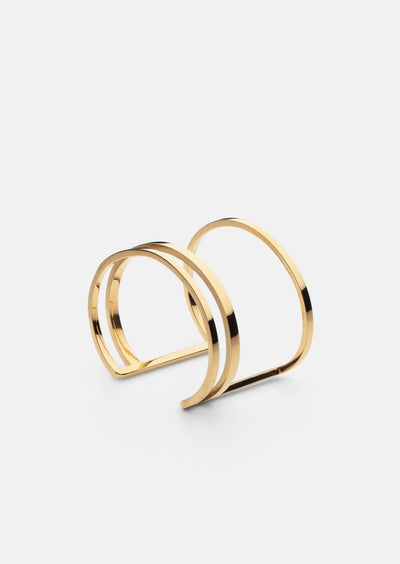 Skultuna Apart Cuff accessory featuring sleek, modern design in polished metal, displayed on a neutral background.