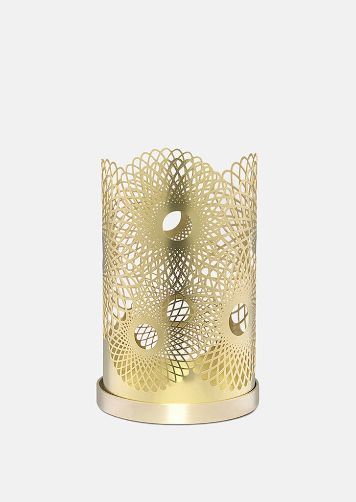 Elegant feather-shaped candle holder by Skultuna, made of polished metal, designed as a stylish home accessories piece.