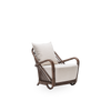 Sika Charlottenborg Lounge Chair in brown rattan with a modern seating design and sleek wooden legs.
